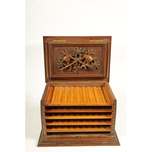 573 - A 19TH CENTURY CARVED BLACK FOREST CIGAR BOX the box surmounted by a carved deer on naturalistic bas... 