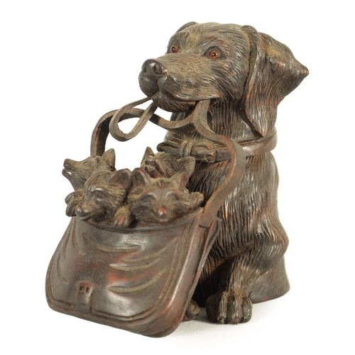 574 - A FINELY CARVED 19TH CENTURY BLACK FOREST DOGS HEAD INKWELL with hinged head and glass eyes depicitn... 