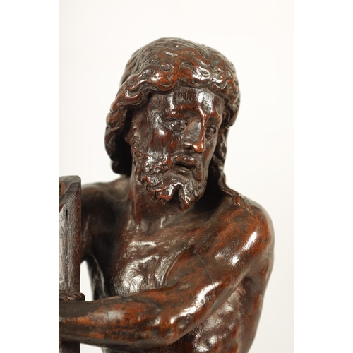 578 - A GOOD 17TH CENTURY CONTINENTAL CARVED WALNUT FIGURE OF CHRIST having superb colour and patina depic... 