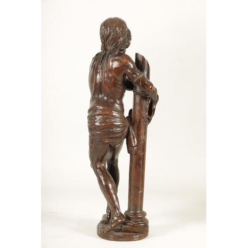 578 - A GOOD 17TH CENTURY CONTINENTAL CARVED WALNUT FIGURE OF CHRIST having superb colour and patina depic... 