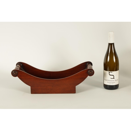 579 - A GEORGIAN BOAT SHAPED MAHOGANY CHEESE COASTER of dished form with turned side handles fronted by ro... 