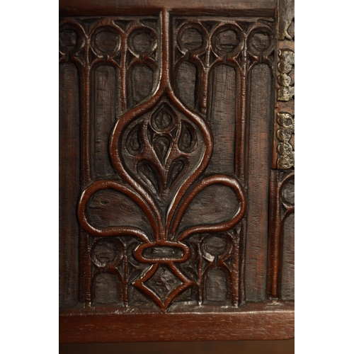 580 - A 16TH/17TH CENTURY SPANISH WALNUT GOTHIC TABLE CABINET the moulded edge hinged top with iron metal ... 