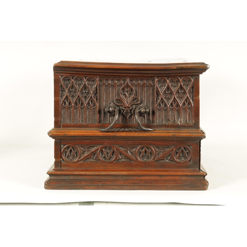 580 - A 16TH/17TH CENTURY SPANISH WALNUT GOTHIC TABLE CABINET the moulded edge hinged top with iron metal ... 