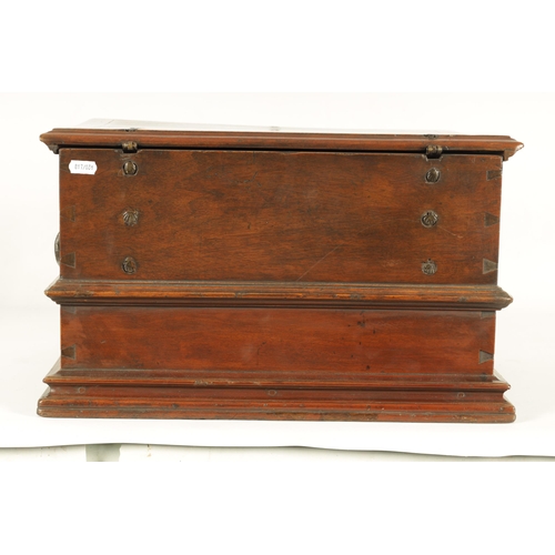 580 - A 16TH/17TH CENTURY SPANISH WALNUT GOTHIC TABLE CABINET the moulded edge hinged top with iron metal ... 