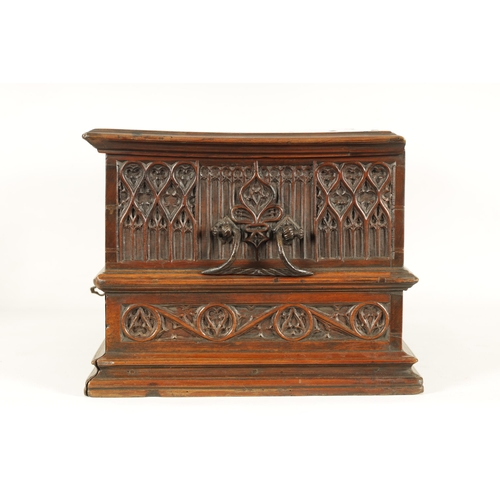 580 - A 16TH/17TH CENTURY SPANISH WALNUT GOTHIC TABLE CABINET the moulded edge hinged top with iron metal ... 