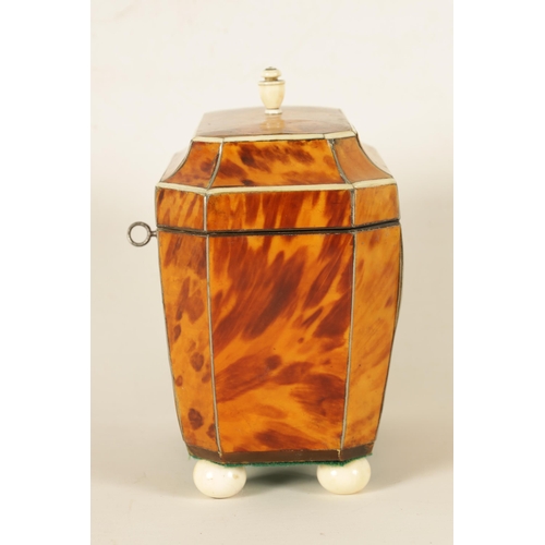 582 - A REGENCY TORTOISESHELL AND IVORY BANDED SARCOPHAGUS TEA CADDY with hinged moulded lid enclosing a d... 