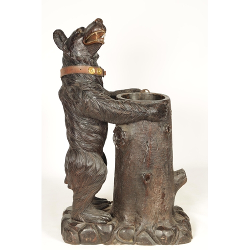 586 - AN IMPRESSIVE 19TH CENTURY LINDEN WOOD BLACK FOREST CARVED BEAR STICK STAND depicting a standing bea... 