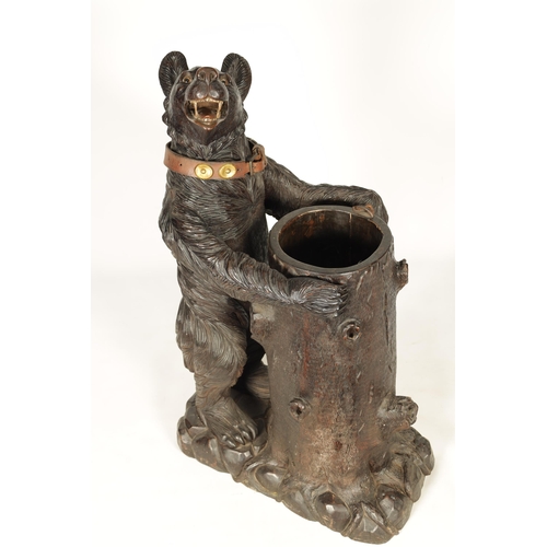 586 - AN IMPRESSIVE 19TH CENTURY LINDEN WOOD BLACK FOREST CARVED BEAR STICK STAND depicting a standing bea... 