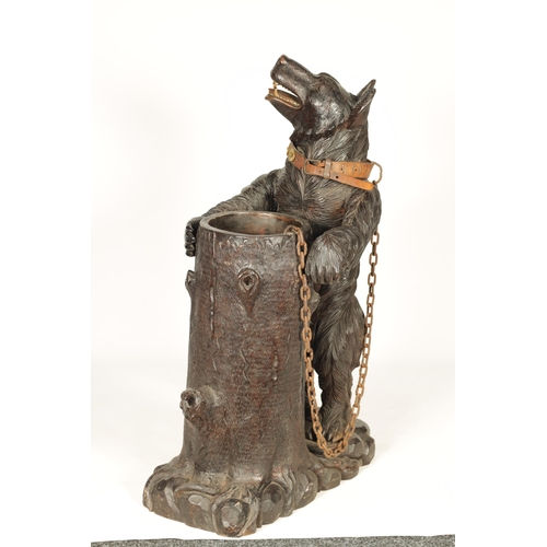 586 - AN IMPRESSIVE 19TH CENTURY LINDEN WOOD BLACK FOREST CARVED BEAR STICK STAND depicting a standing bea... 