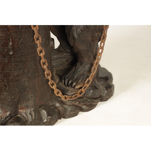 586 - AN IMPRESSIVE 19TH CENTURY LINDEN WOOD BLACK FOREST CARVED BEAR STICK STAND depicting a standing bea... 