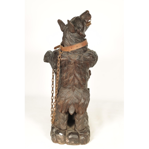 586 - AN IMPRESSIVE 19TH CENTURY LINDEN WOOD BLACK FOREST CARVED BEAR STICK STAND depicting a standing bea... 