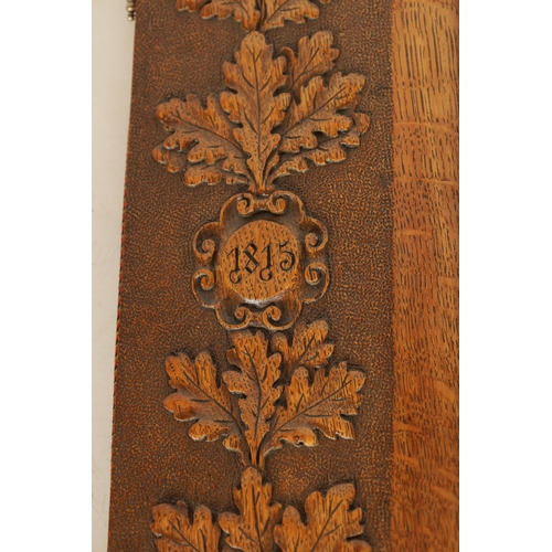 587 - A LATE 19TH CENTURY BLACK FOREST CARVED OAK FRAME with carved leaf work borders inscribed and dated ... 