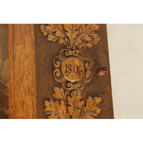 587 - A LATE 19TH CENTURY BLACK FOREST CARVED OAK FRAME with carved leaf work borders inscribed and dated ... 