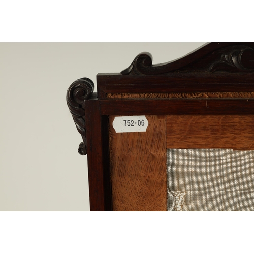 588 - A WILLIAM IV ROSEWOOD FACE SCREEN with scroll-carved frame and tapestry needle work panel depicting ... 