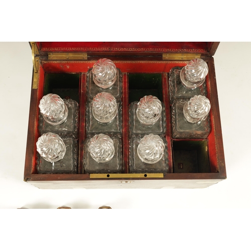 591 - A GEORGE III BRASS BOUND MAHOGANY CAMPAIGN DECANTER SET the box with brass straps and flush fitting ... 