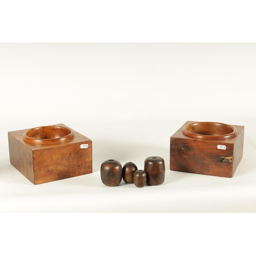 596 - A MATCHED PAIR OF 19TH CENTURY ELM CASH DISPENSERS with turned deep centres TOGETHER WITH FOUR MARIN... 