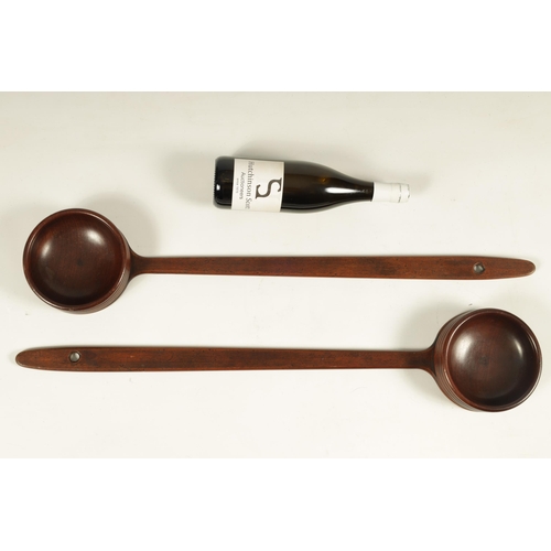 598 - A PAIR OF GEORGE III MAHOGANY LONG HANDLED ALMS DISHES - POSSIBLY SCOTTISH OR IRISH of ribbed circul... 