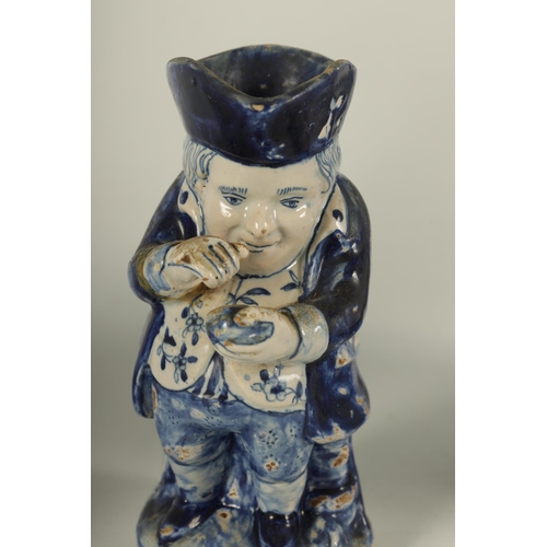 60 - THREE 18TH CENTURY BLUE AND WHITE DELFTWARE TOBY JUGS depicting portly gentleman (28cm high and smal... 