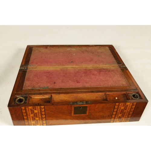 604 - A 19TH CENTURY INLAID WALNUT WRITING BOX with hinged lid opening to reveal a fitted interior with wr... 