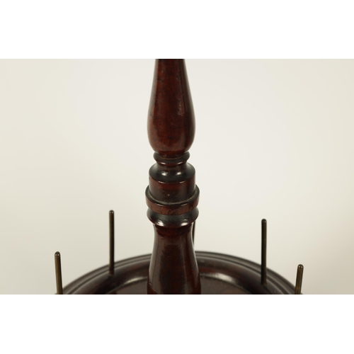 607 - A 19TH CENTURY TREENWARE MAHOGANY BOBBIN STAND of two graduated tiers with ring turned shaped border... 