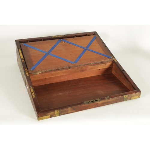 610 - A 19TH CENTURY BRASS BOUND MAHOGANY WRITING SLOPE with hinged angled writing surface and a fittted i... 