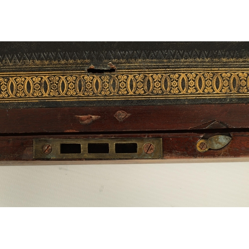 610 - A 19TH CENTURY BRASS BOUND MAHOGANY WRITING SLOPE with hinged angled writing surface and a fittted i... 