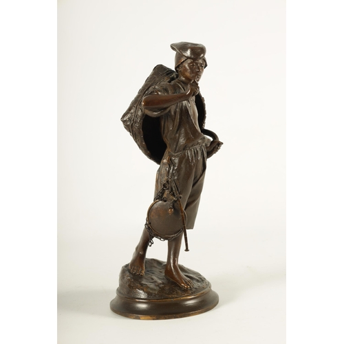 617 - A LATE 19TH CENTURY ITALIAN BRONZE SCULPTURE modelled as a Neapolitan fisherman on naturalistic circ... 