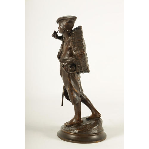 617 - A LATE 19TH CENTURY ITALIAN BRONZE SCULPTURE modelled as a Neapolitan fisherman on naturalistic circ... 