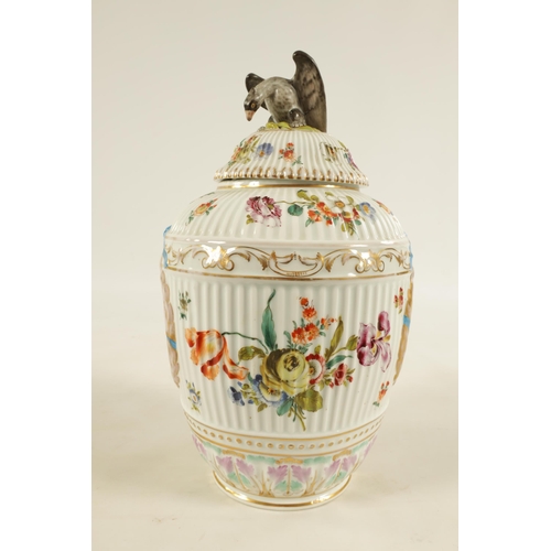 62 - A LATE 19TH CENTURY DRESDEN LARGE VASE AND COVER IN THE MANNER OF AUGUSTUS REX of ribbed form with e... 