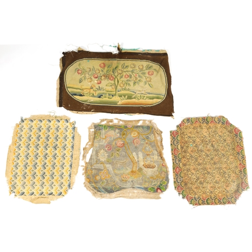 620 - A GROUP OF FOUR 18TH CENTURY NEEDLEWORK SEAT COVERS of varying designs.