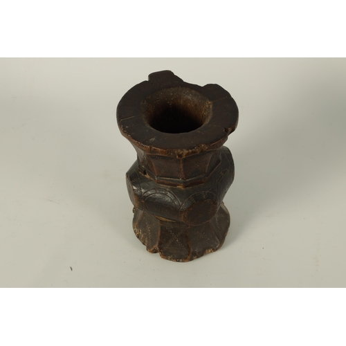 624 - AN 18TH-CENTURY AFRICAN-CARVED HARDWOOD TRIBAL MORTAR of scratch carved panelled double-sided form w... 