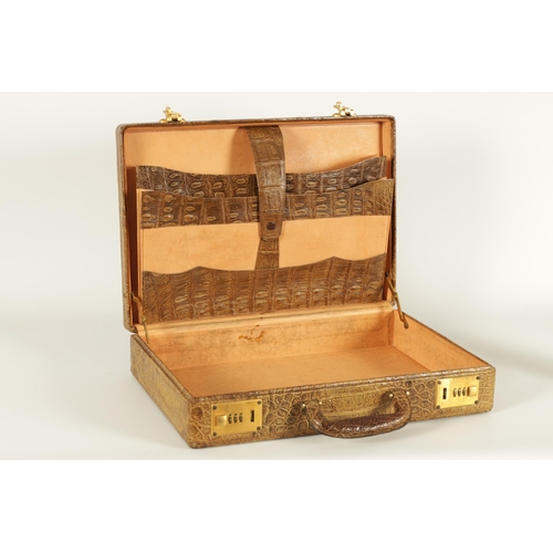 632 - A GOOD VINTAGE CROCODILE BRIEFCASE with fitted document slots to the interior and double gilt brass ... 