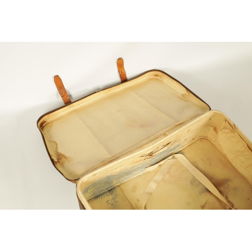 634 - A VINTAGE LOUIS VUITTON SUITCASE with a monogram covering and tan leather straps (78cm wide 53cm dee... 