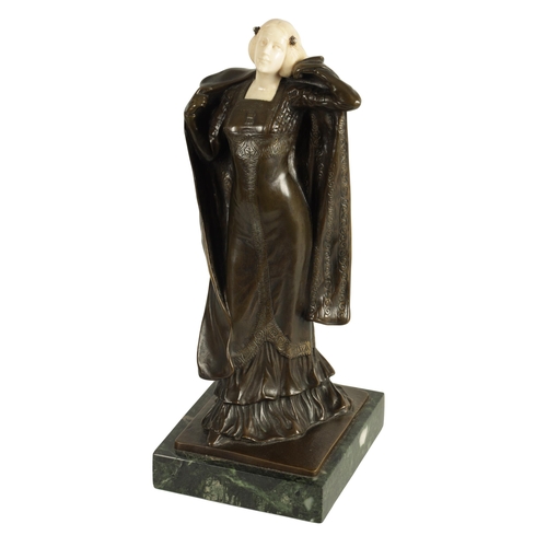 635 - ANTON ENDSTORFER (1880-1960) AN ART NOUVEAU BRONZE AND IVORY FIGURAL SCULPTURE depicting a young lad... 