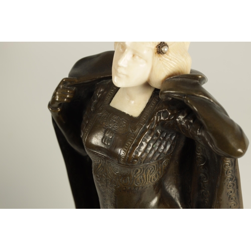 635 - ANTON ENDSTORFER (1880-1960) AN ART NOUVEAU BRONZE AND IVORY FIGURAL SCULPTURE depicting a young lad... 