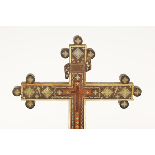 642 - AN 18TH/19TH CENTURY INDO PORTUGUESE MOTHER OF PEARL AND BONE-INLAID CRUCIFIX - on tapered platform ... 