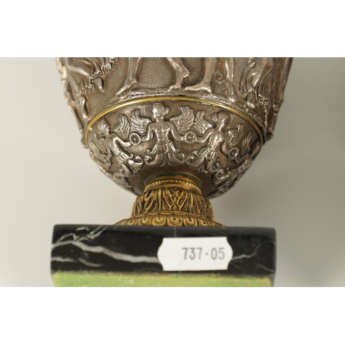 647 - A PAIR OF LATE 19TH CENTURY BRONZE AND SILVERED BRONZE GRAND TOUR URNS with stylised handles and sho... 