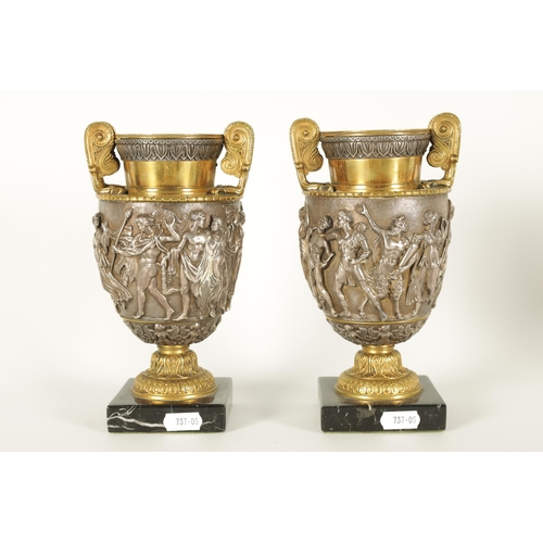 647 - A PAIR OF LATE 19TH CENTURY BRONZE AND SILVERED BRONZE GRAND TOUR URNS with stylised handles and sho... 