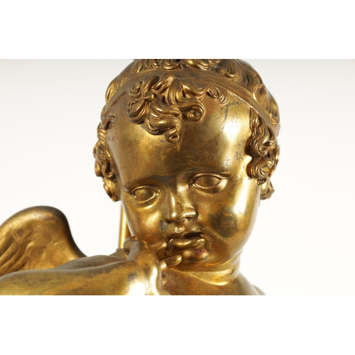 649 - AN EARLY 20TH CENTURY GILT BRONZE FIGURAL LAMP ON ROUGE MARBLE PEDESTAL the lamp modelled as Cupid s... 