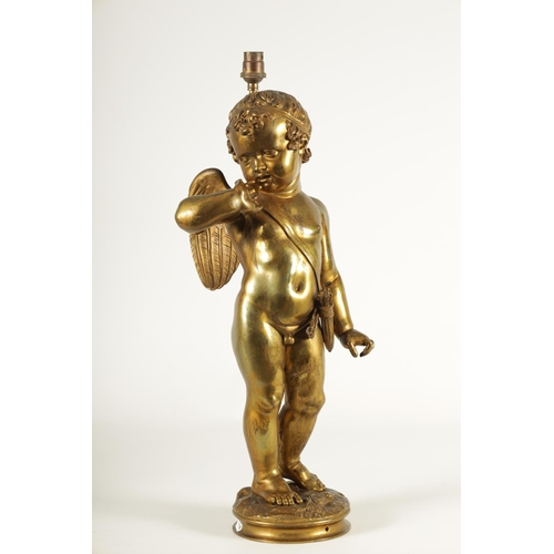 649 - AN EARLY 20TH CENTURY GILT BRONZE FIGURAL LAMP ON ROUGE MARBLE PEDESTAL the lamp modelled as Cupid s... 