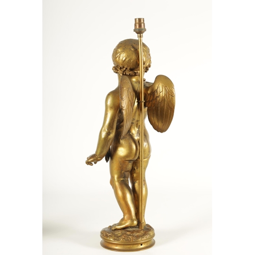 649 - AN EARLY 20TH CENTURY GILT BRONZE FIGURAL LAMP ON ROUGE MARBLE PEDESTAL the lamp modelled as Cupid s... 