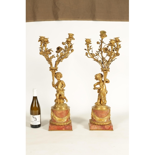 650 - AN IMPRESSIVE PAIR OF 19TH CENTURY FRENCH GILT BRONZE AND ROUGE MARBLE FOUR BRANCH CANDELABRA with f... 