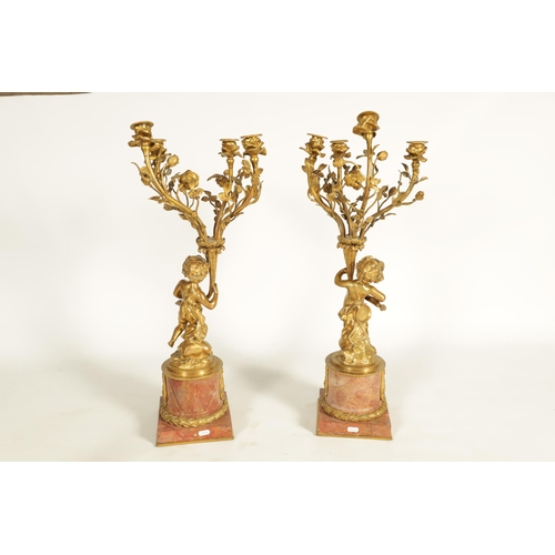 650 - AN IMPRESSIVE PAIR OF 19TH CENTURY FRENCH GILT BRONZE AND ROUGE MARBLE FOUR BRANCH CANDELABRA with f... 