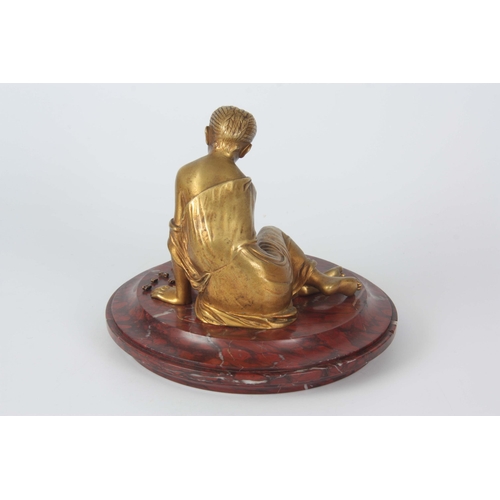 653 - AN EARLY 20TH CENTURY CLASSICAL FIGURAL GILT BRONZE SCULPTURE depicting a young girl mounted on a ro... 