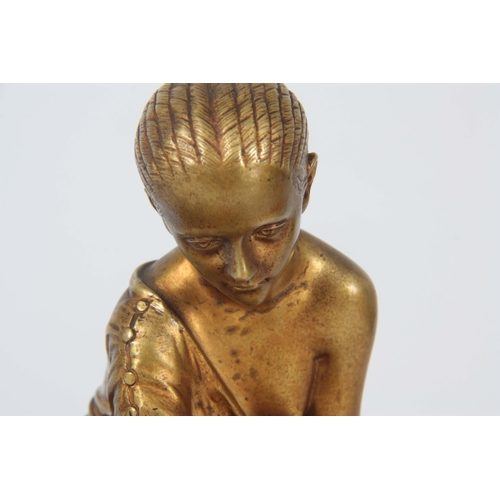 653 - AN EARLY 20TH CENTURY CLASSICAL FIGURAL GILT BRONZE SCULPTURE depicting a young girl mounted on a ro... 