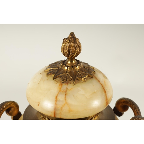 654 - A PAIR OF 19TH CENTURY FRENCH SIENA MARBLE AND ORMOLU MOUNTED CASSOLETTES the covered urn shaped bod... 