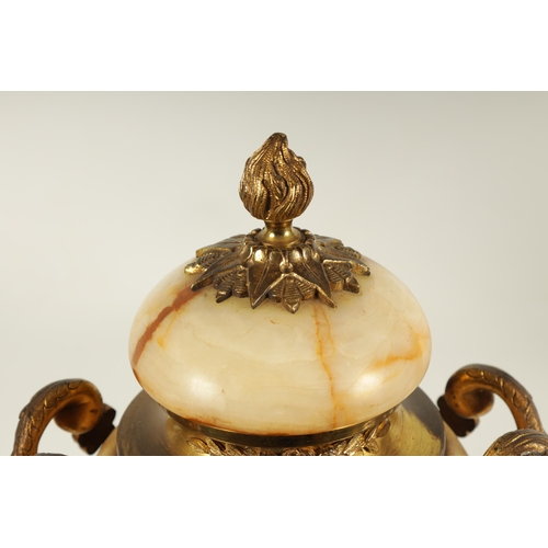 654 - A PAIR OF 19TH CENTURY FRENCH SIENA MARBLE AND ORMOLU MOUNTED CASSOLETTES the covered urn shaped bod... 