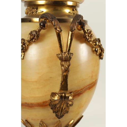 654 - A PAIR OF 19TH CENTURY FRENCH SIENA MARBLE AND ORMOLU MOUNTED CASSOLETTES the covered urn shaped bod... 