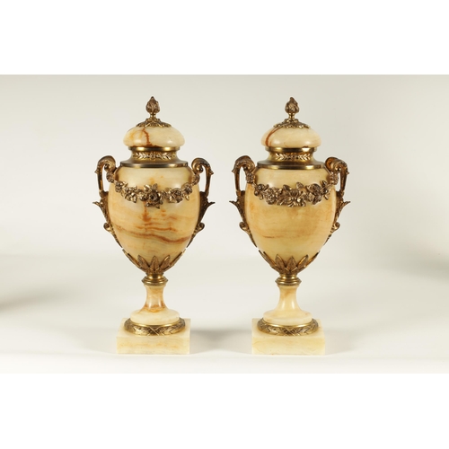 654 - A PAIR OF 19TH CENTURY FRENCH SIENA MARBLE AND ORMOLU MOUNTED CASSOLETTES the covered urn shaped bod... 