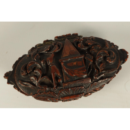 659 - A 19TH CENTURY CARVED CAQUILLA NUT SNUFF BOX of oval lidded form with finely carved scrolled leafwor... 